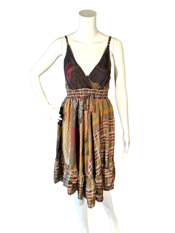 A multicolored floral summer dress with a tie on the front center, displayed on a mannequin.