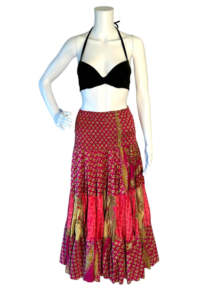Pink and tan print maxi skirt in gathered tiers.  Wide elastic top can become a strapless dress.  Recycled Indian silks.