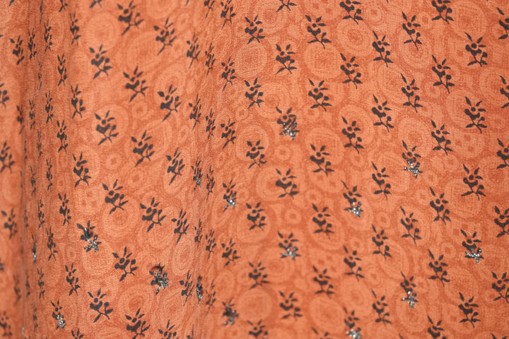 Patterned orange vintage silk with small black sequins and black flowers