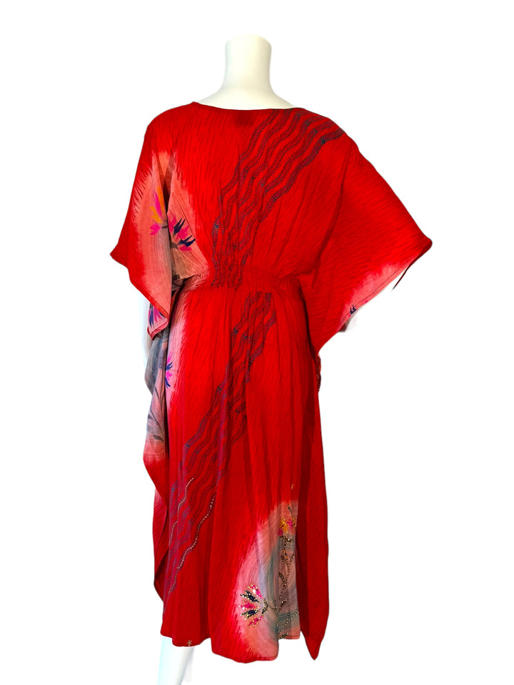Back view of red XS vintage silk kaftan with blue graphic print and embroidery