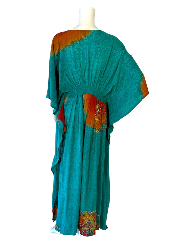 Back view of ML vintage silk kaftan in blue green with rust patterns and embroidery
