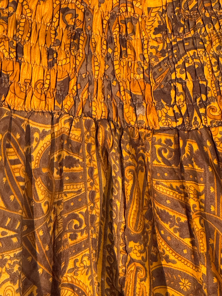 Deep gold paisley print on recycled silk blend