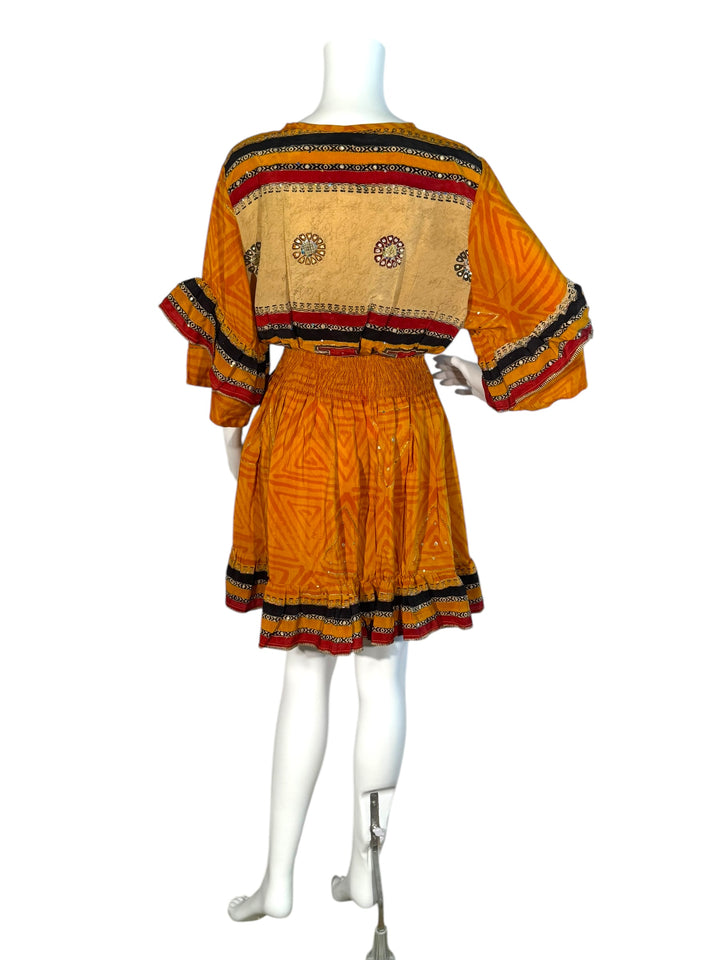 Sofia dress back view on mannequin in orange vintage silk