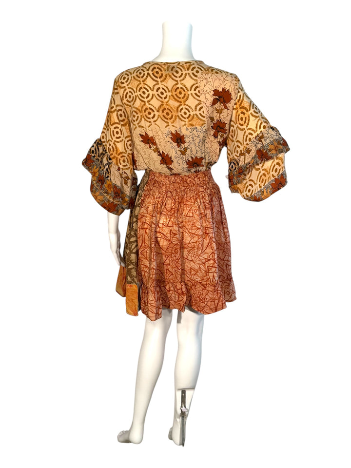 Sofia dress back view on mannequin in beige floral vintage silk