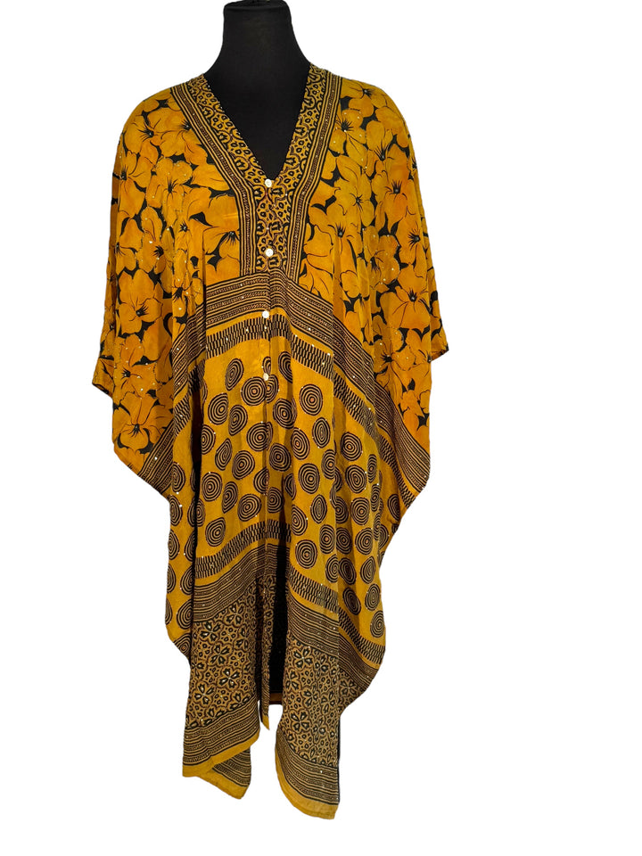 Front view of vintage silk Willow Wrap in gold and black  graphic and floral print with sequins