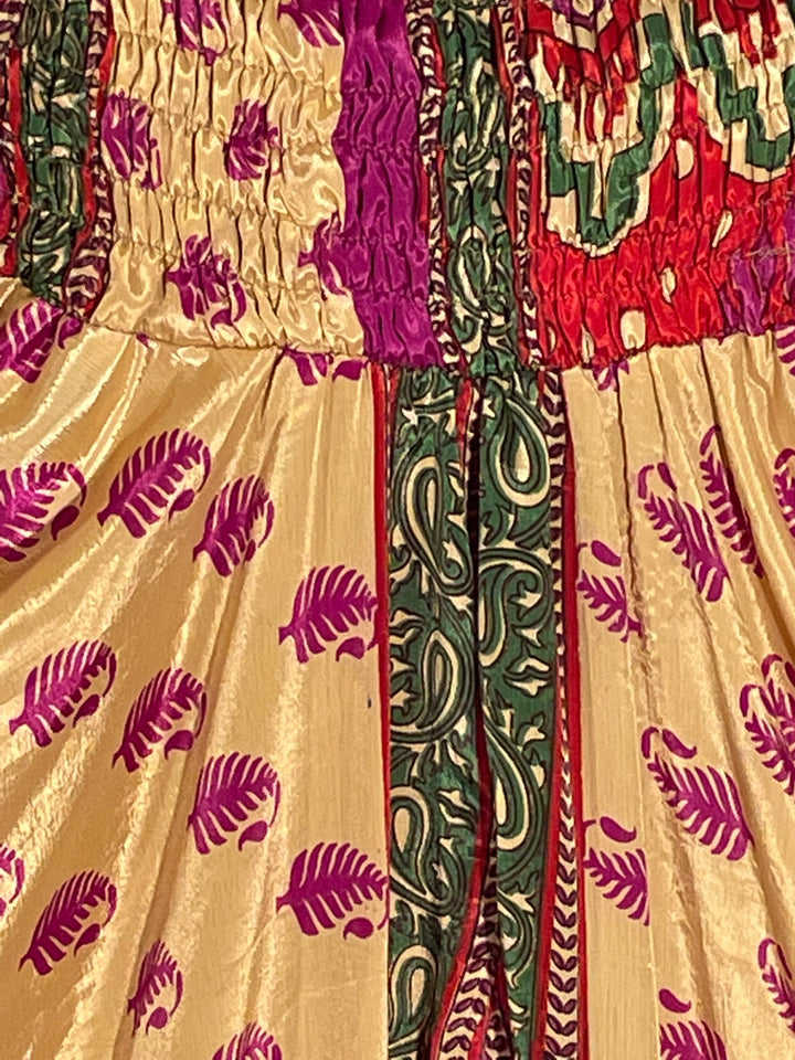 Gold sustainable silk blend with fuchsia feathers
