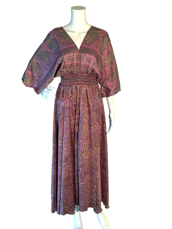 Lavender paisley print boho silk blend dress.  Midi length with V neck front and back and tassel tie.  Flattering elastic gathering under bust.