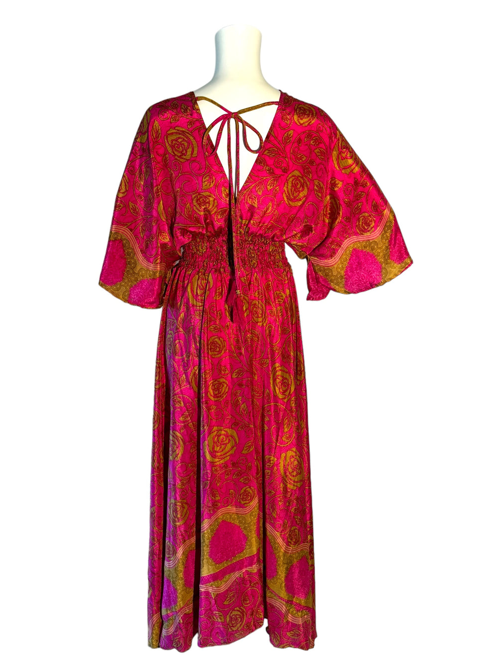 Reverse view of bright pink and gold print Boho dress in sustainable silk blend.