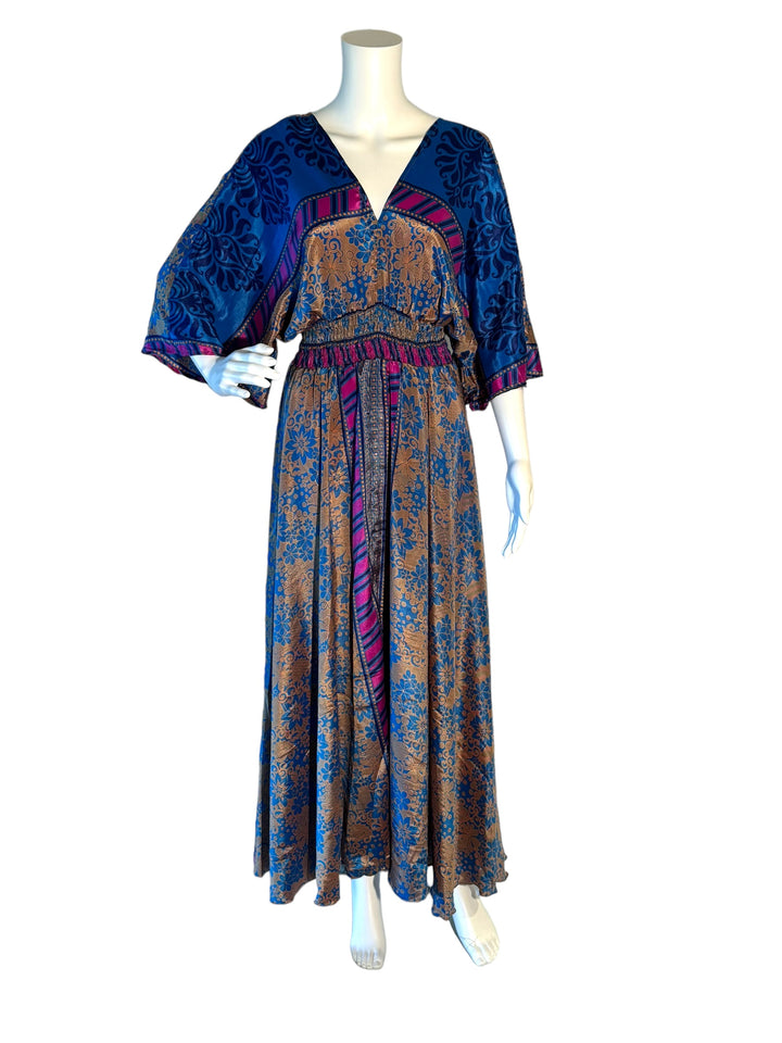 Blue and pink floral print boho silk blend dress.  Midi length with V neck front and back and tassel tie.  Flattering elastic gathering under bust.