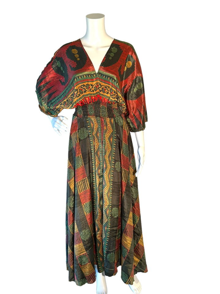 Dark green, red and gold multi print boho silk blend dress.  Midi length with V neck front and back and tassel tie.  Flattering elastic gathering under bust.