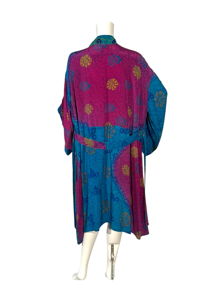 Back view of blue and fuchsia unisex kimono with large flowers