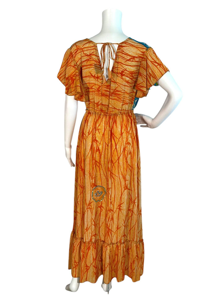 Emily dress in ML orange with bright blue vintage sillk on mannequin