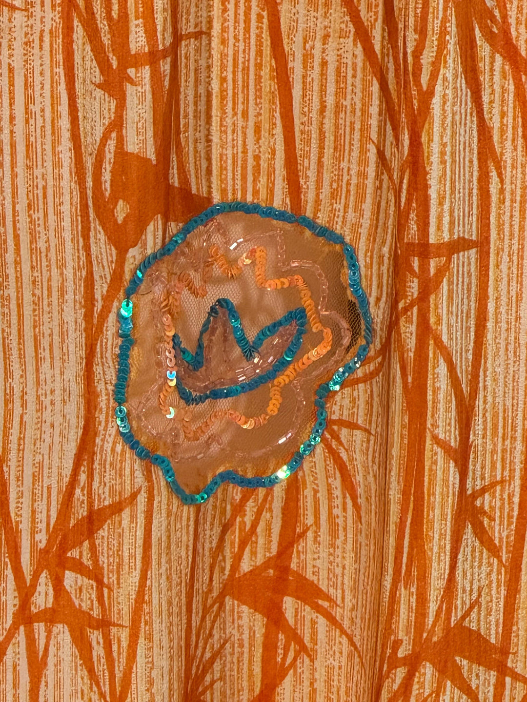 Orange silk bamboo patter with blue sequin design