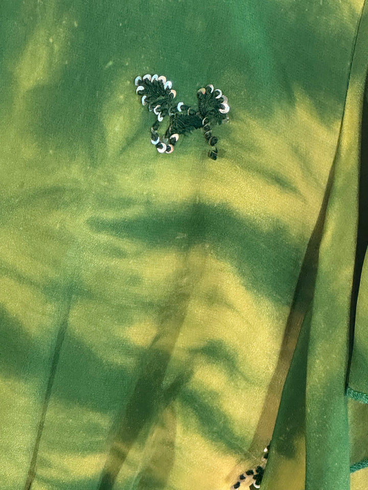 Green dyed fabric with sequin detail