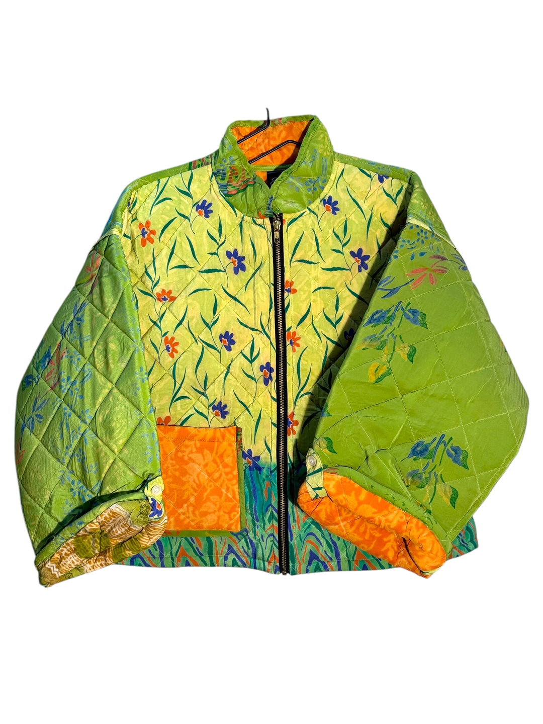 Quilted green  silk jacket with floral pattern and orange accents on a white background