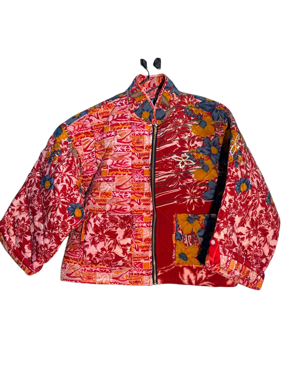 Colorful vintage quilted silk jacket with floral patterns in red and gold