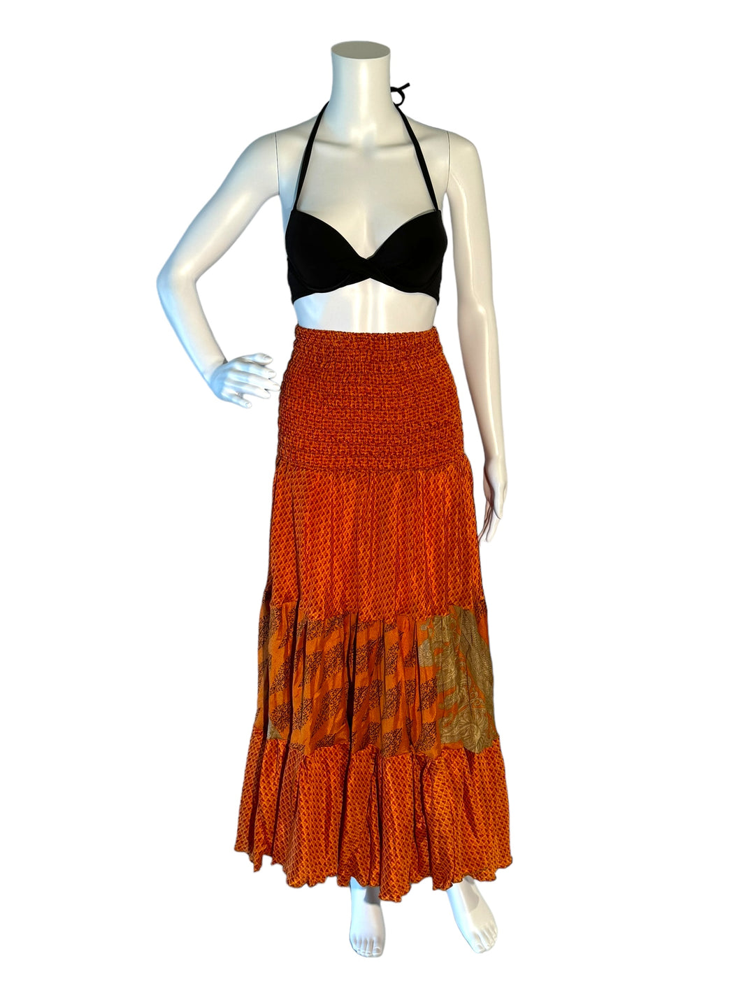 Orange multi print maxi skirt in gathered tiers.  Wide elastic top can become a strapless dress.  Recycled Indian silks.