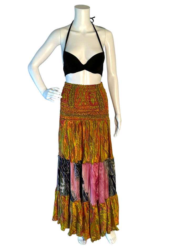 Green multi print maxi skirt in gathered tiers.  Wide elastic top can become a strapless dress.  Recycled Indian silks.