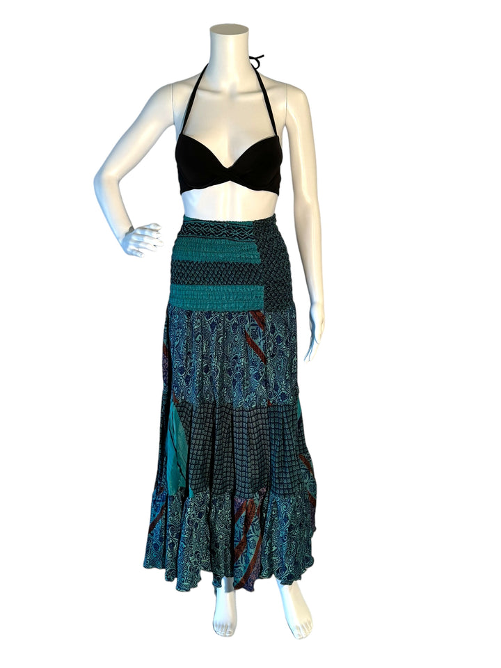 Teal blue multi print maxi skirt in gathered tiers.  Wide elastic top can become a strapless dress.  Recycled Indian silks.