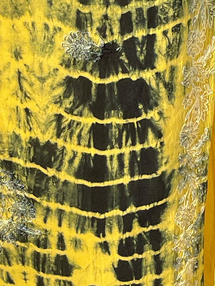 Close up of yellow dip dye silk pattern