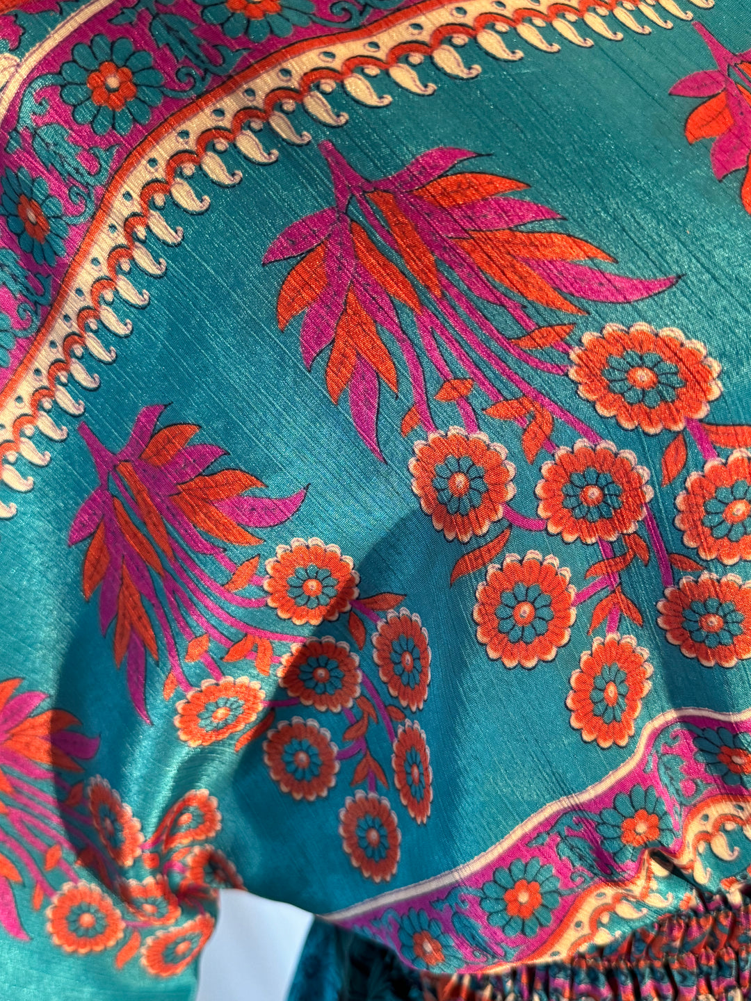 Bright blue and orange print on sustainable silk blend dress.