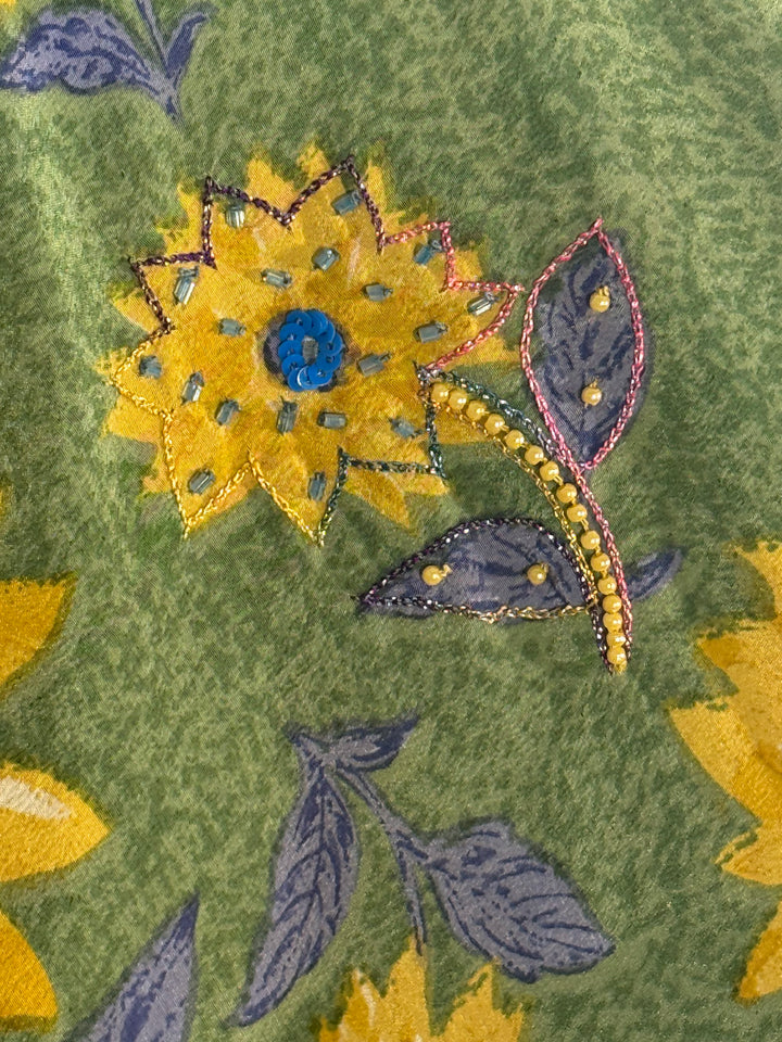 Ivy Kaftan by Silk Ranch in green vintage silk with yellow and bllue un flowers  and golden sequins, fabric detail 2