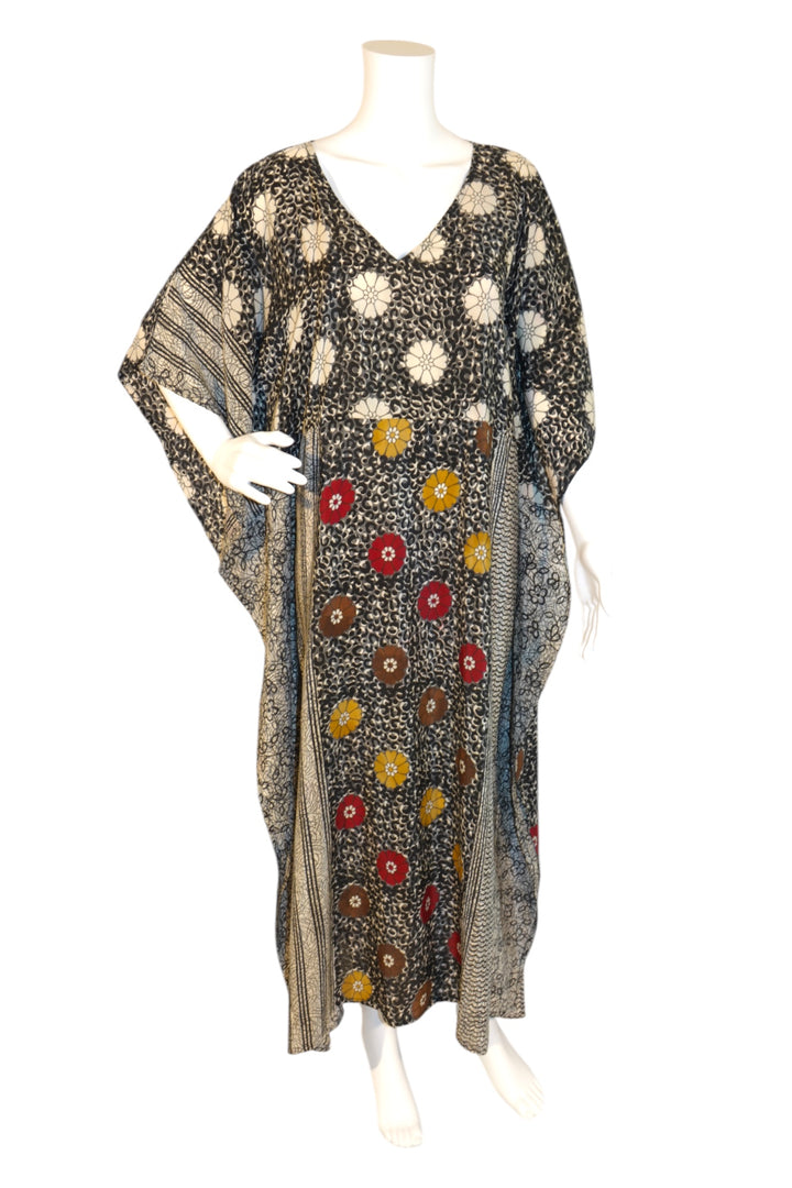 Floral patterned kaftan on a mannequin against a white background