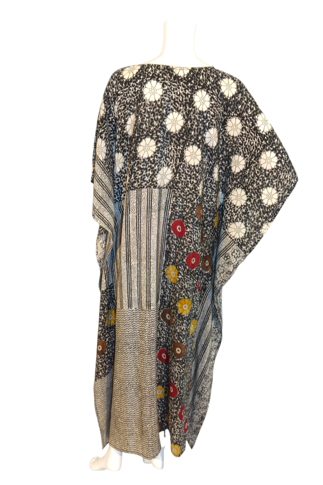 Silk Ranch Vintage Silk Colorful patterned fabric kaftan back on a mannequin  a white background