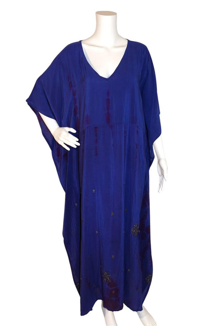 Blue Silk Ranch vintage silk kaftan on a mannequin against a white background