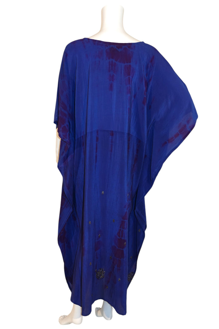 Blue Silk Ranch vintage silk kaftan with red accents on a mannequin against a white background - back view