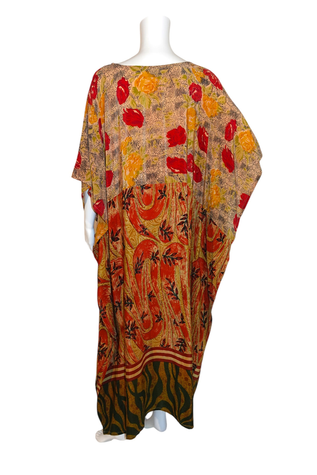Colorful patterned Silk Ranch vintage silk kaftan on a mannequin against a white background