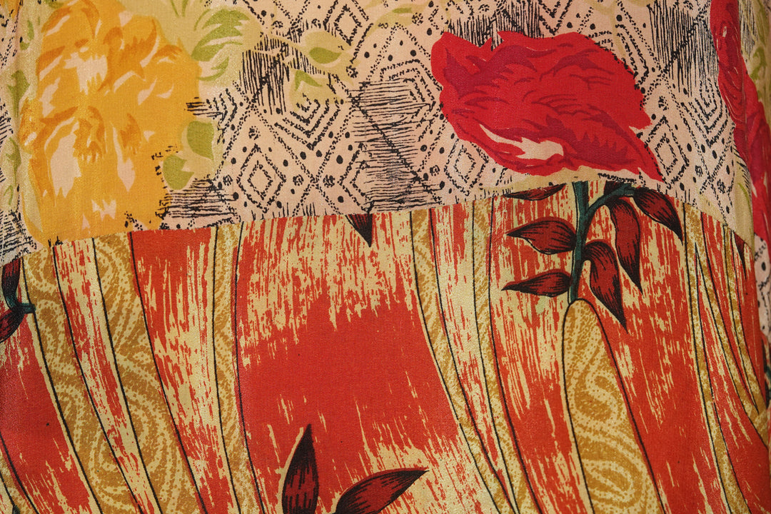 Close-up of a colorful vintage silk with floral patterns and bold colors.