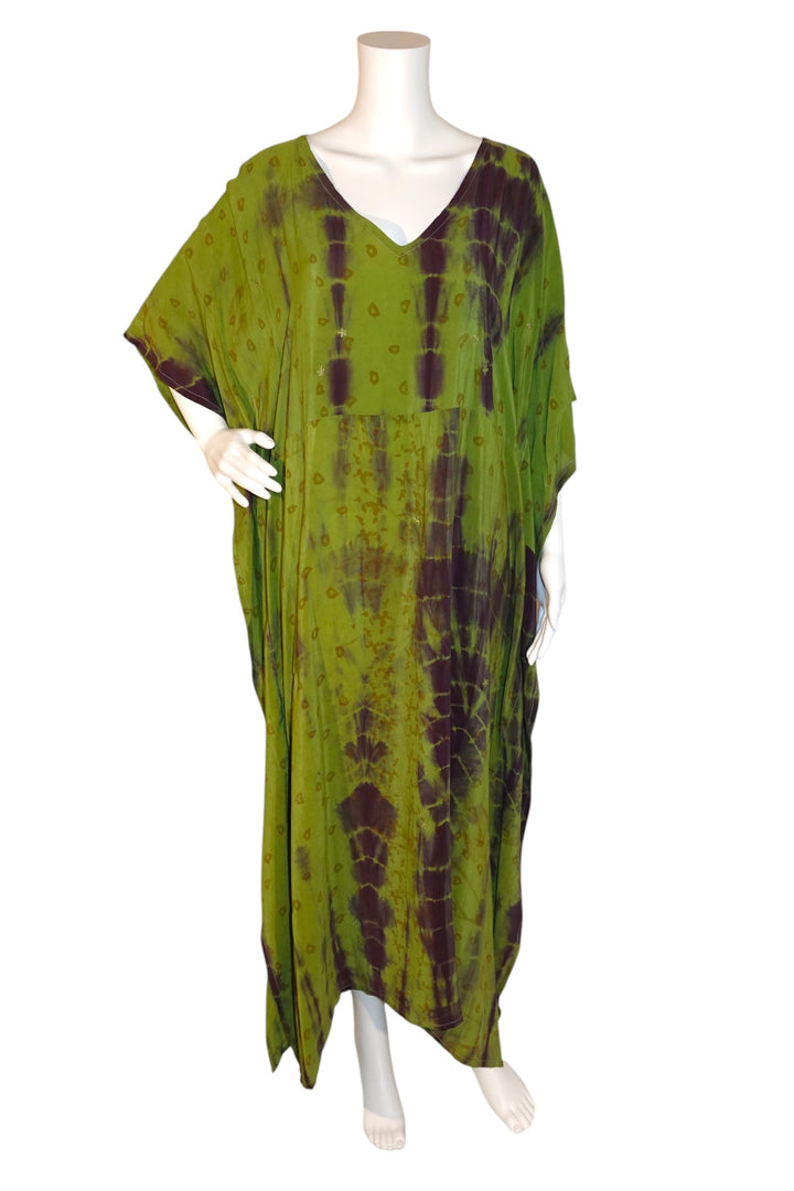 Green dip-dye vintage silk kaftan by Silk Ranch on a mannequin against a white background