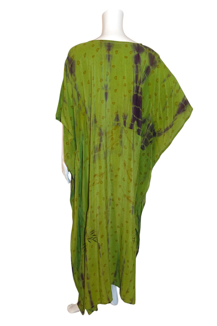 Green tie-dye kaftan in vintage silk by Silk Ranch  on a mannequin against a white background