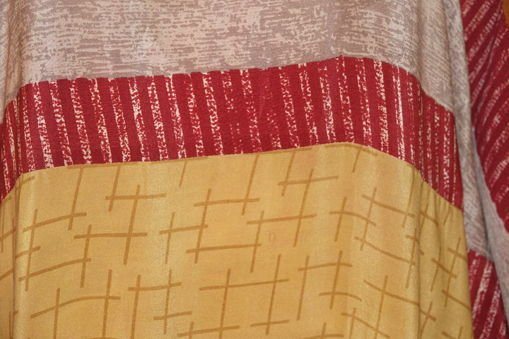 Close-up of vintage silk with red and yellow patterns