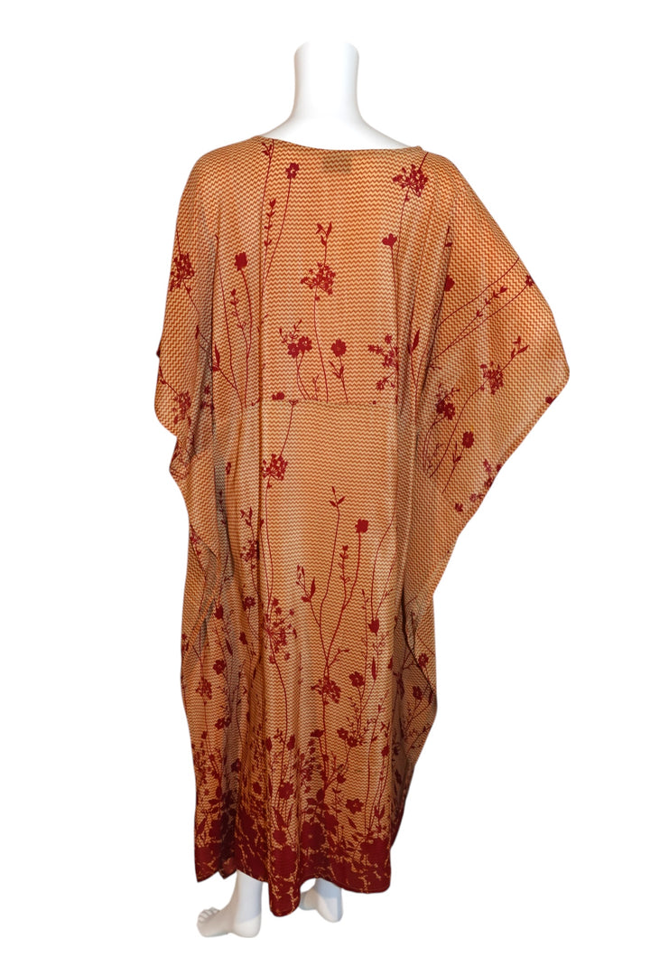Orange vintage silk kaftan with red floral pattern on a white background