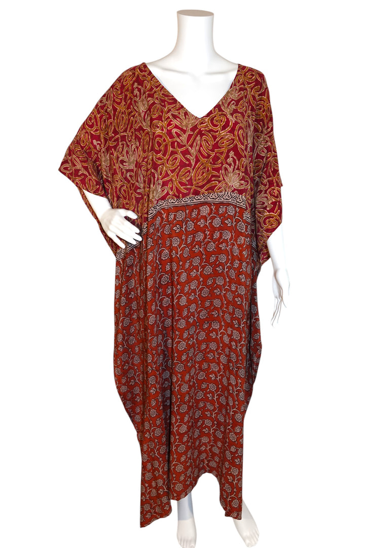Red patterned Silk Ranch vintage silk kaftan on a mannequin against a white background