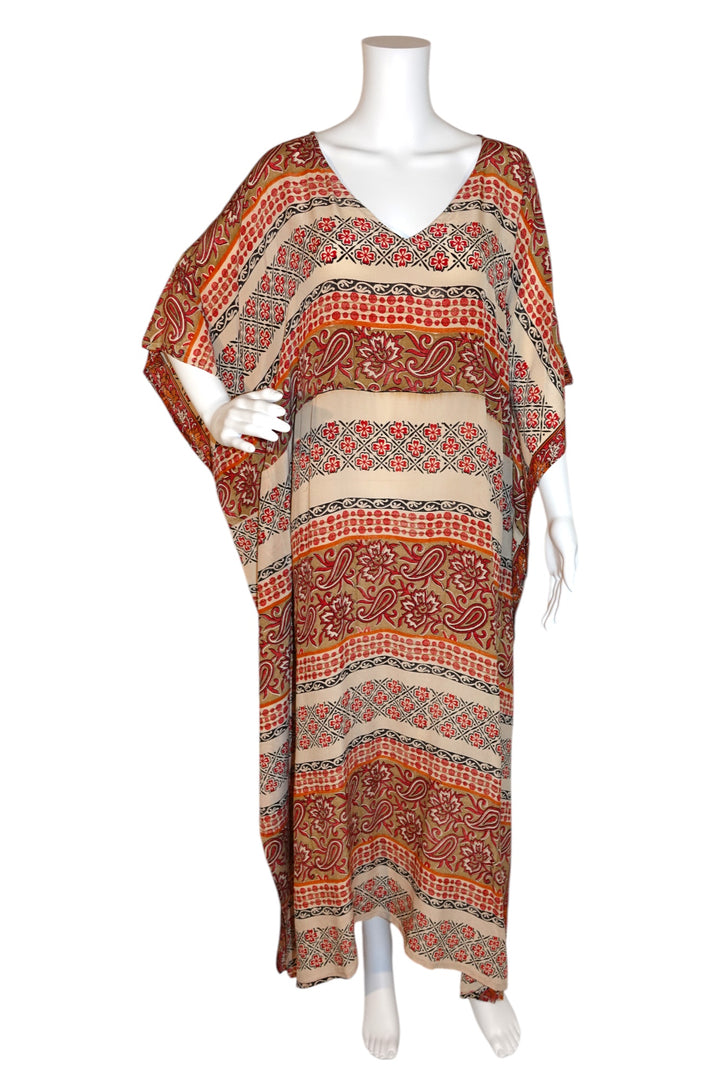 Patterned Silk Ranch vintage silk kaftan in orange and red on a mannequin against a white background