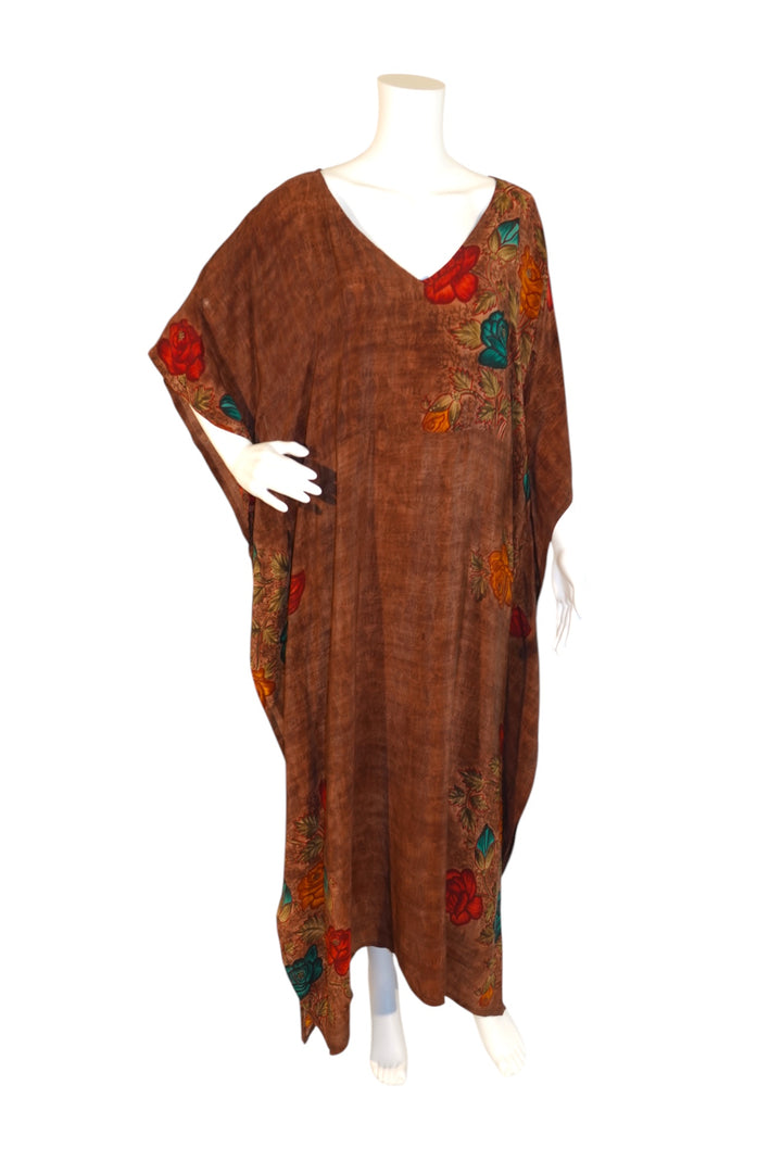 Brown vintage silk kaftan with colorful floral patterns on a mannequin