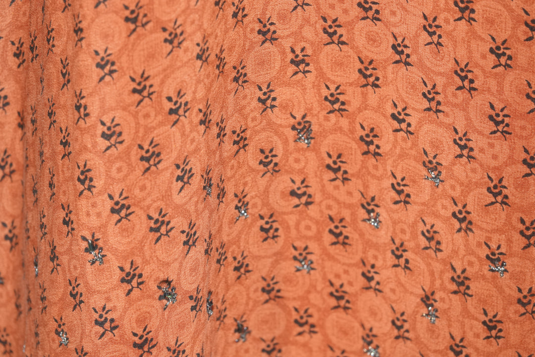 Patterned orange vintage silk with small black sequins and black flowers