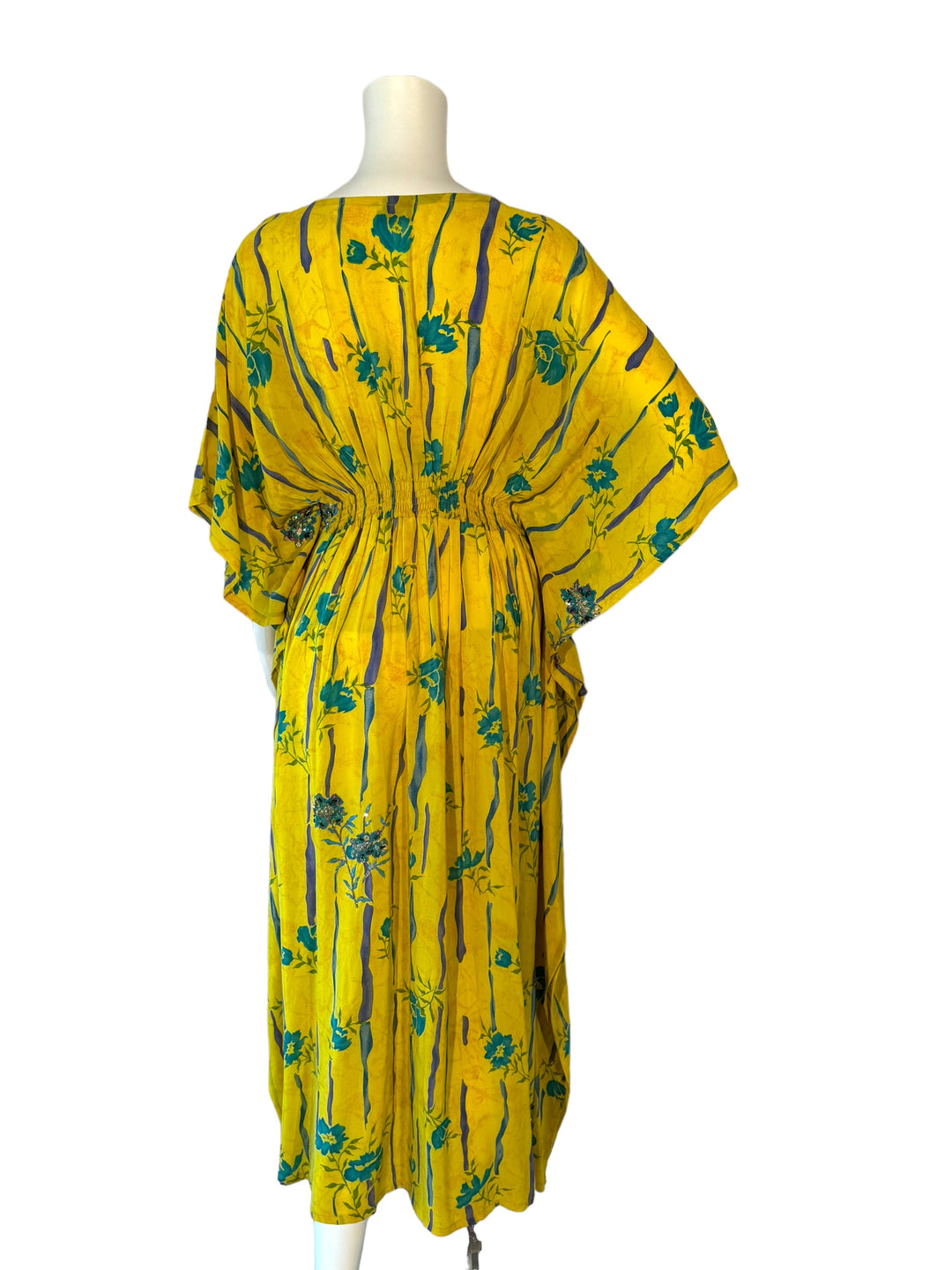 Back view of yellow vintage silk kaftan in SM with blue stripes and embroidered flowers