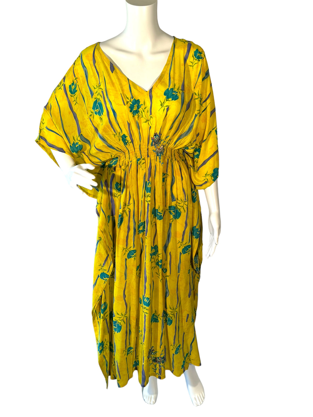 Sustainable yellow silk kaftan with bright blue ad purple streaks, and embroidered & sequin flowers. V neck maxi length from vintage saree silk. Cold water washable. Easy to style and light and airy to wear.