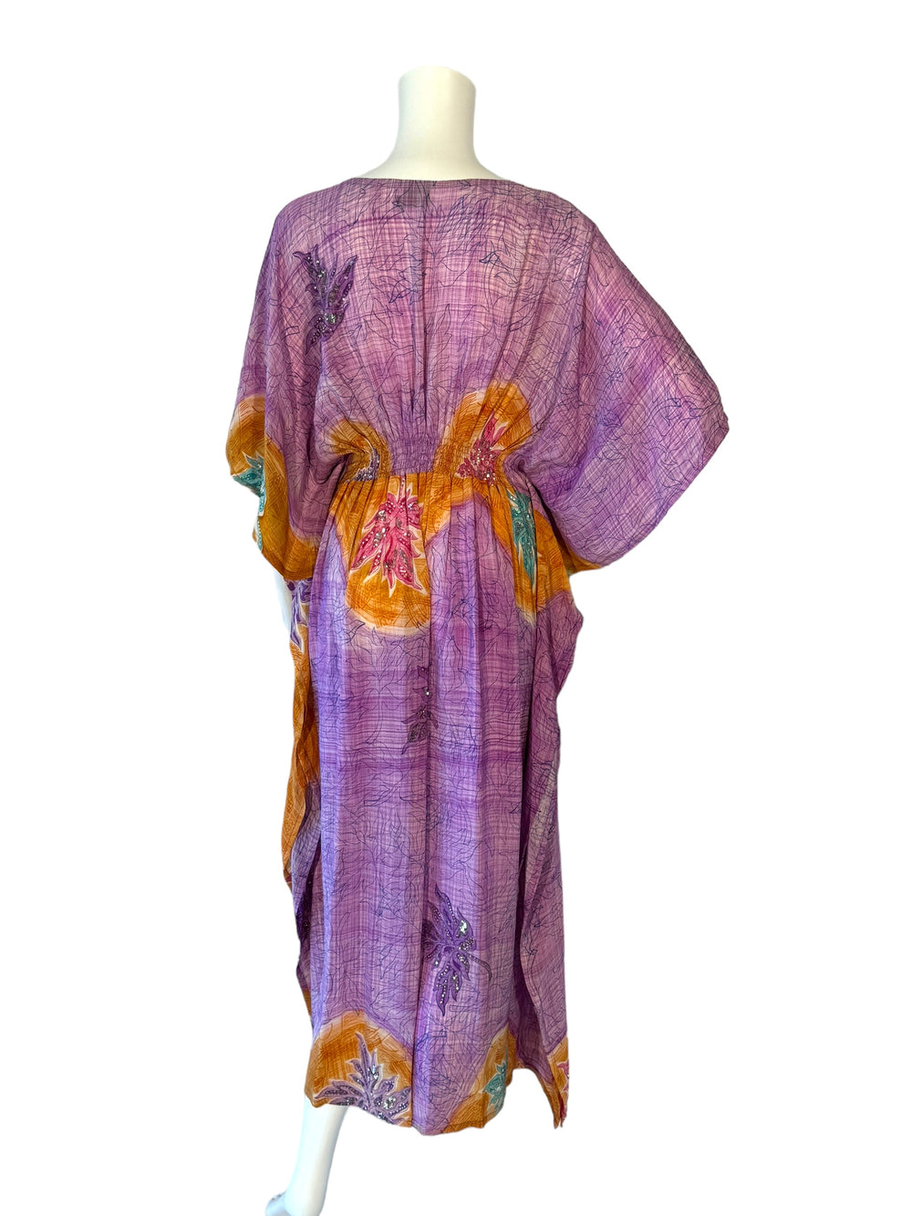 Back view of vintage silk SM kaftan in purple and orange with bright flowers