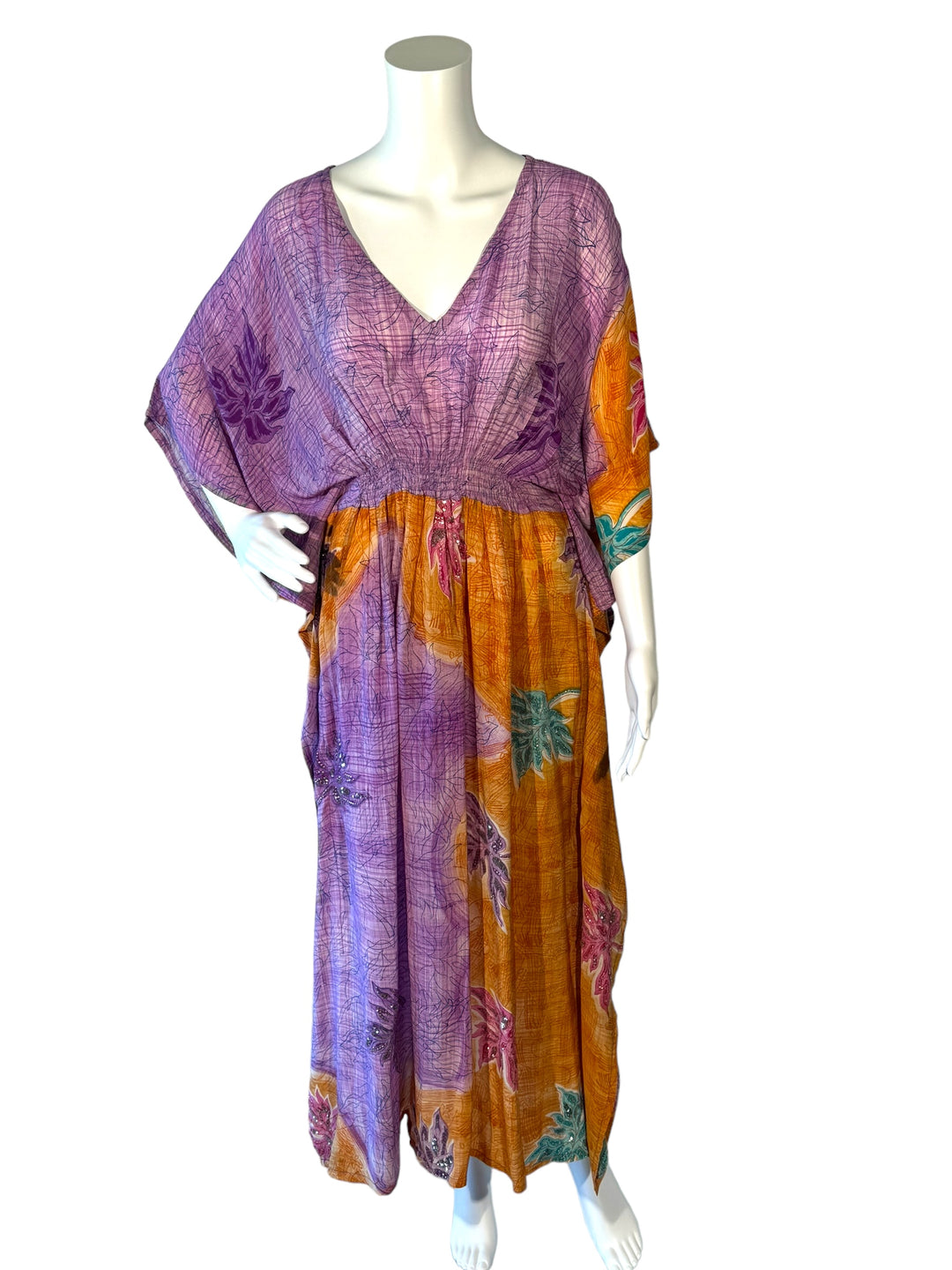 Front view of vintage silk kaftan in SM in purple and orange with bright flowers