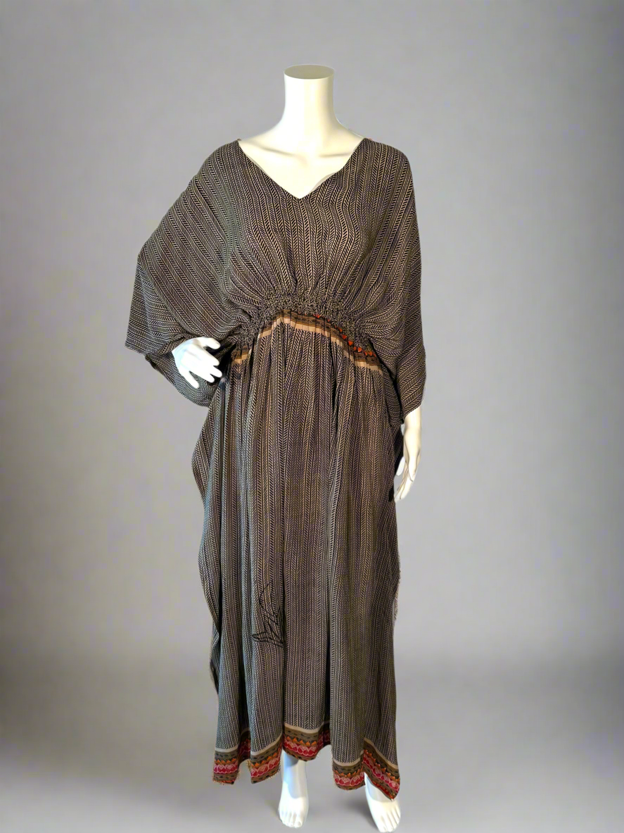 Brown vintage silk kaftan on a mannequin against a gray background
