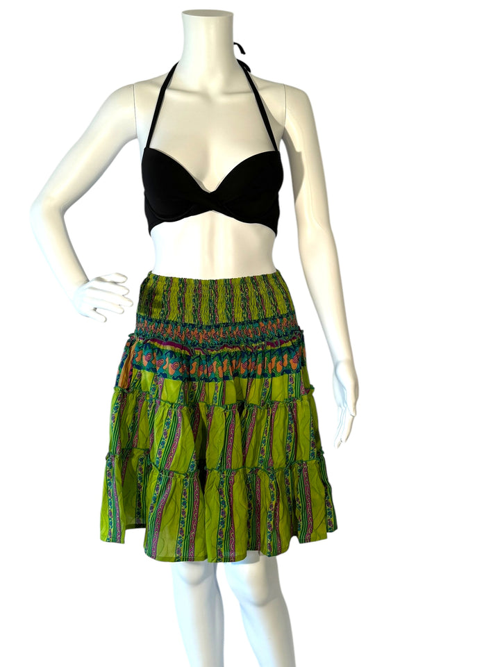 Mannequin wearing gather elastic waist vintage silk tiered skirt in bright green with pink and orange print