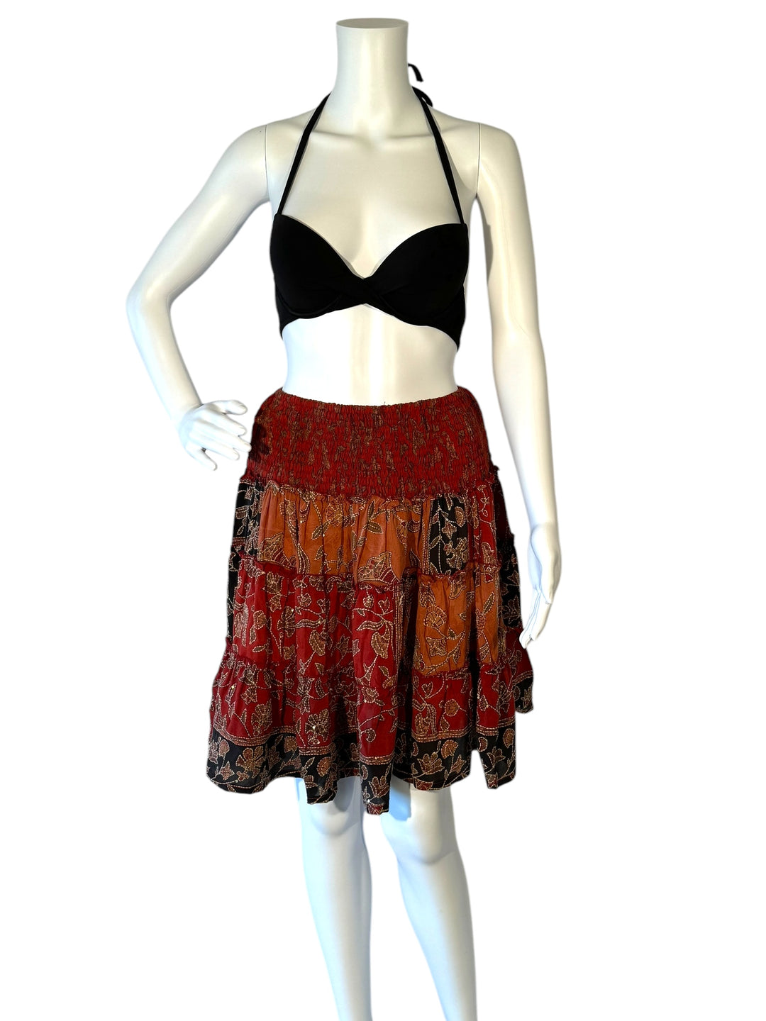 Mannequin wearing gather elastic waist vintage silk tiered skirt in red embroidered with black and orange