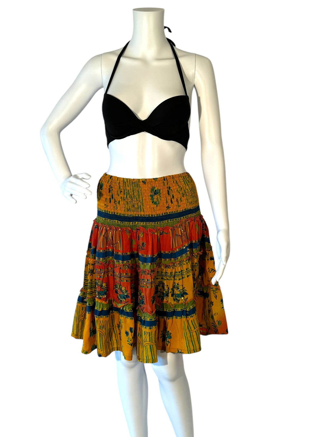 Mannequin wearing gather elastic waist vintage silk tiered skirt in yellow with red blue and green floral print