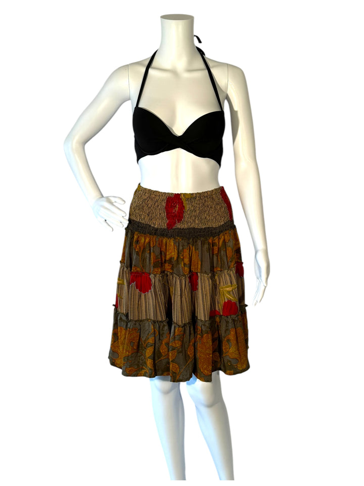 Mannequin wearing vintage silk gathered elastic short tiered skirt in gray with yellow  brown and red floral print