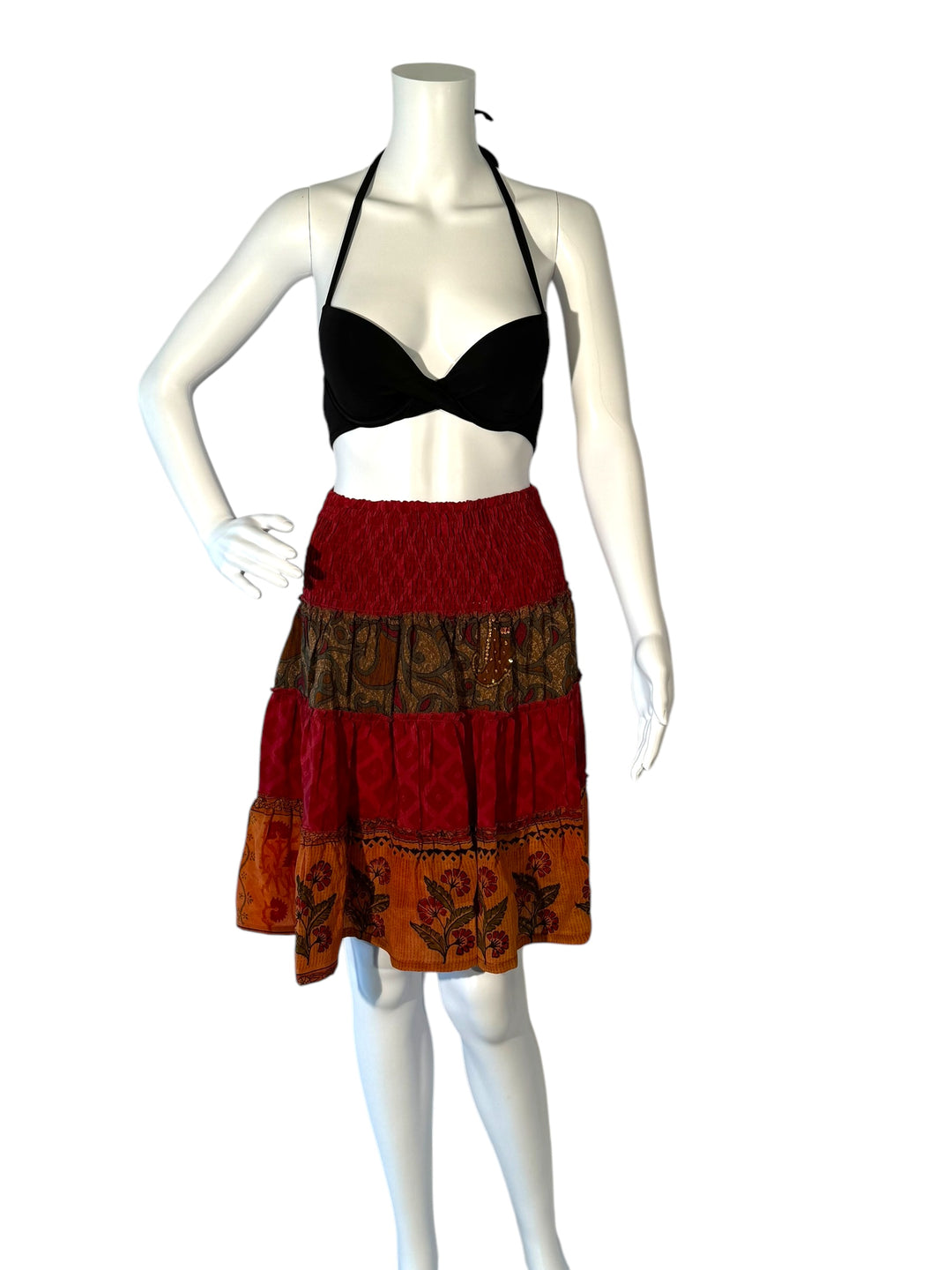 Mannequin wearing vintage silk gathered elastic short tiered skirt in red and gold floral with gold embroidery 